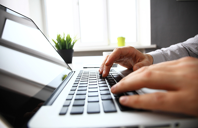 businessman is typing on keyboard in office