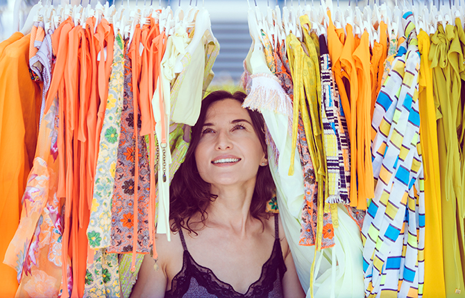 Attractive young woman dreamily looks at things in the store - shopping and shopaholic, consumerism, sales, too much choice, temptation and dream big concepts