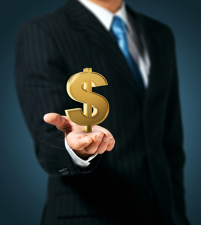 Businessman holding dollar sign